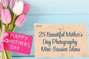 A blue wooden background with some pink and white tulips and a pink mother's day card. A paper-clipped note alongside reads 25 Beautiful Mother's Day Photography mini session ideas.