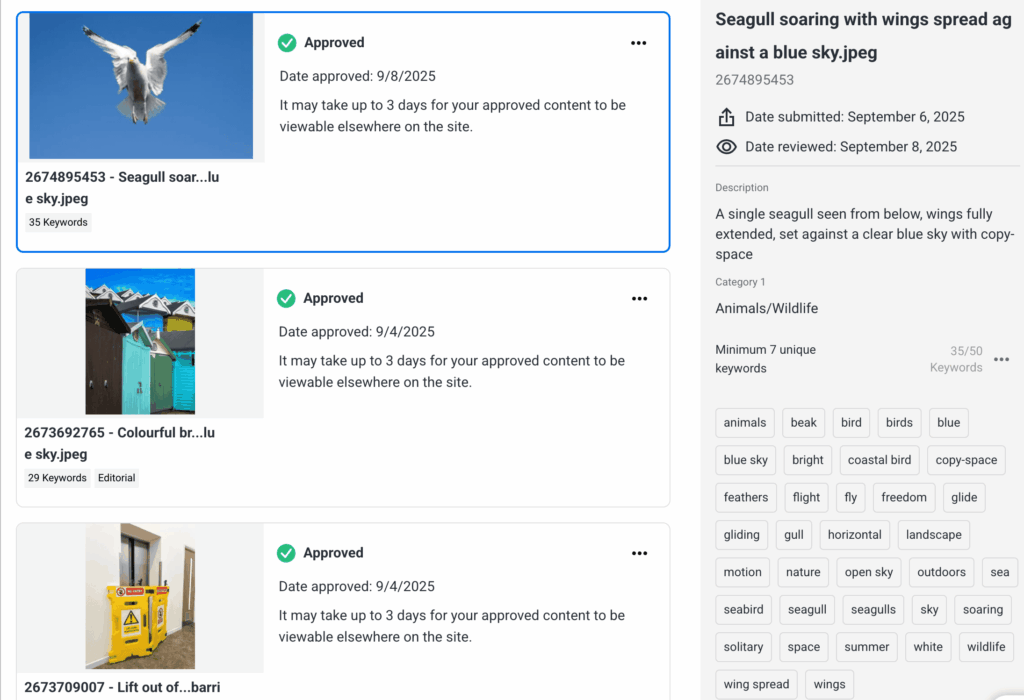 Shutterstock contributor dashboard showing approved photo submissions with description, keywords, and categories.